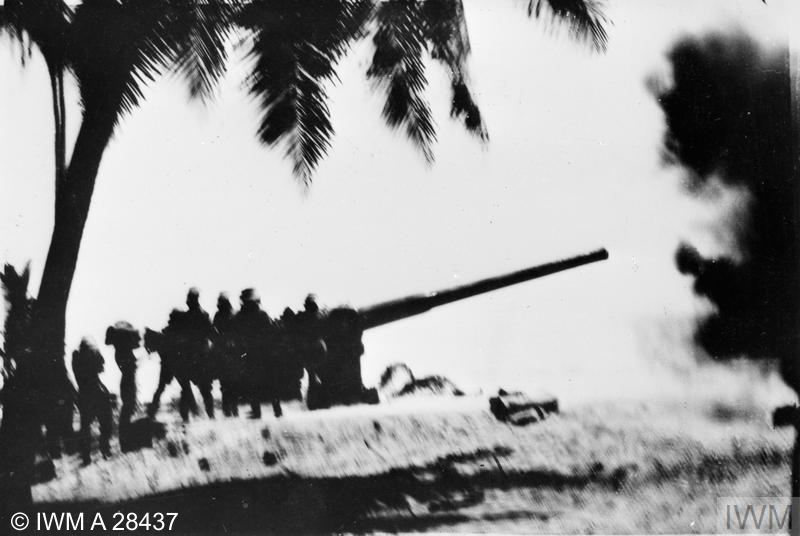 A proof round being fired from a coastal gun installed at Addu Atoll
